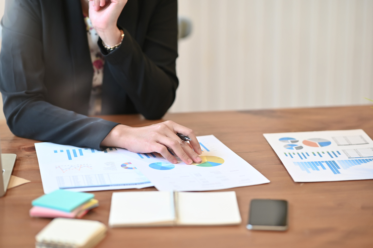 Audit analysis finance data in paper document on working table.